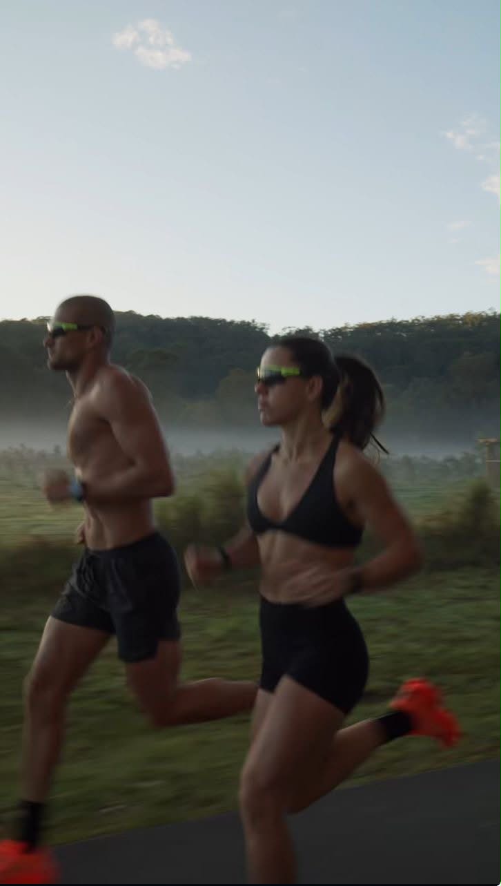 Two runners training at dawn