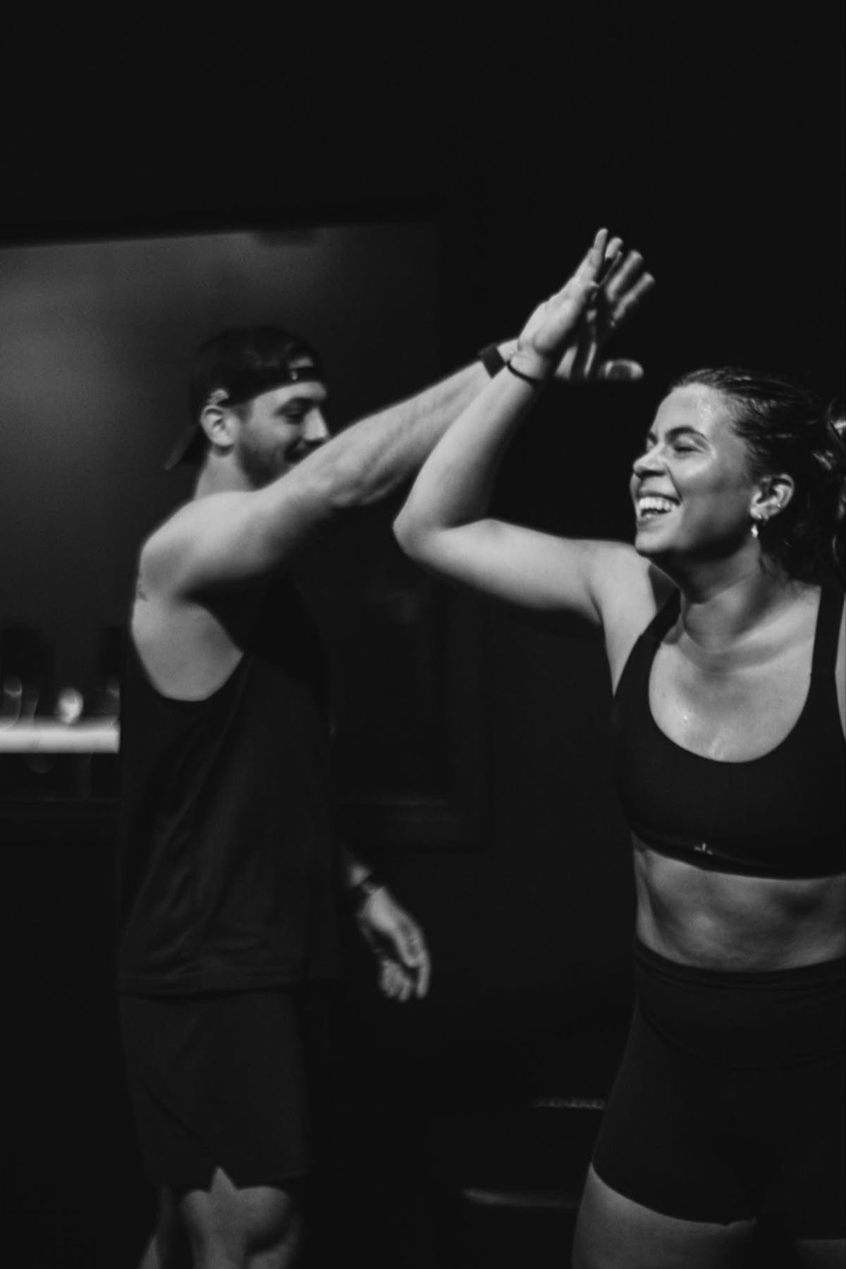Two athletes celebrating a training session